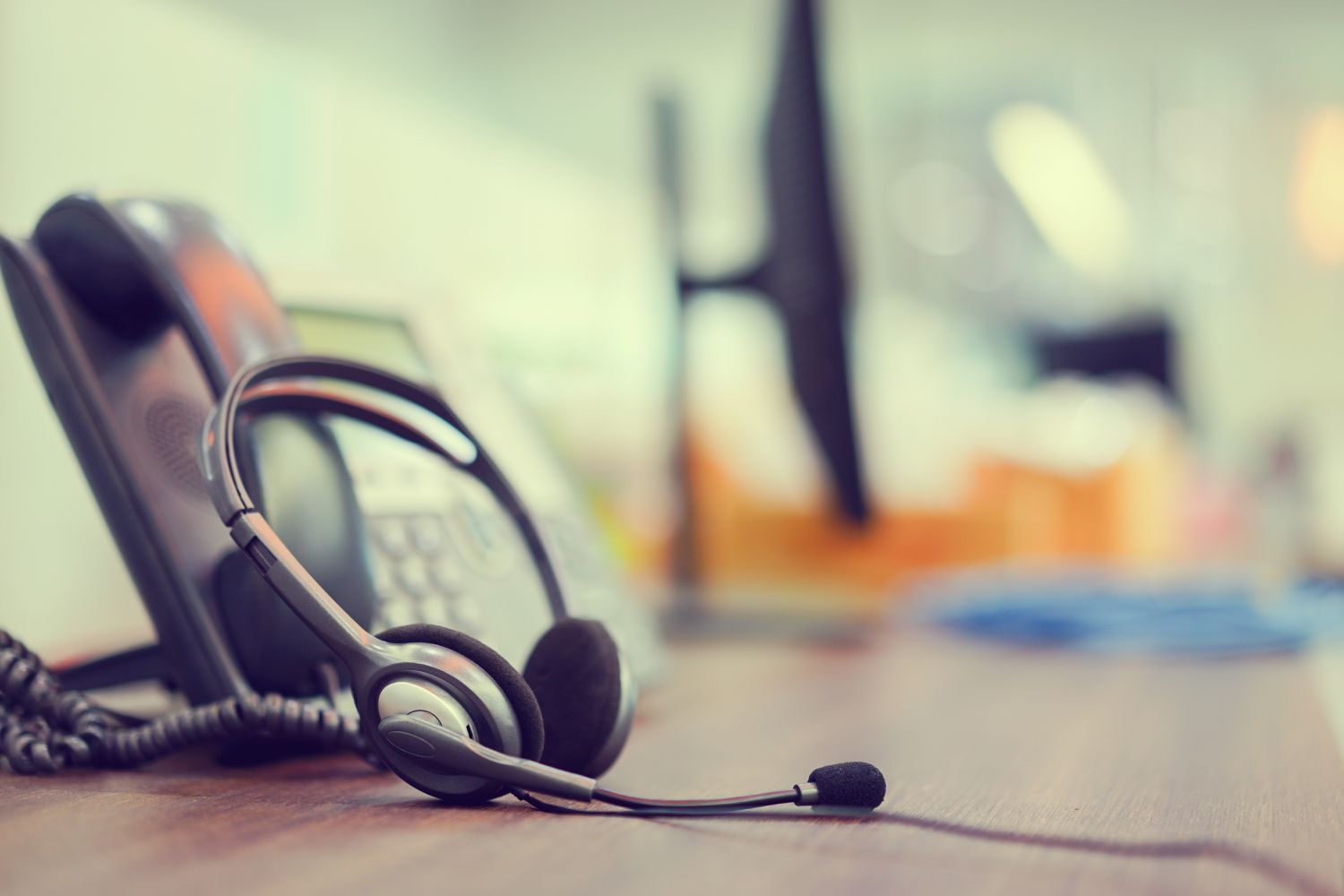 close-up-focus-on-call-center-headset-device--headset-voip-system-with-telephone-answer-machine-technology-at-operation-office-desk-for-hotline-telemarketing-and-network-operator-concept-1016109338-77f05afa.jpg